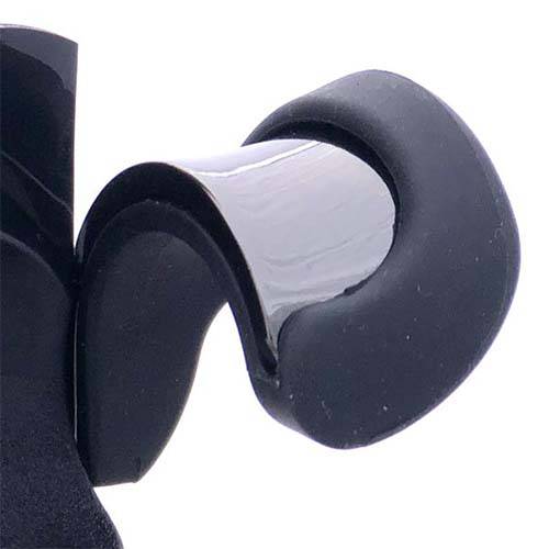 Ton Kooiman Etude Thumb Rest for Clarinet and Oboe, showing the ergonomic, black design made from durable materials."